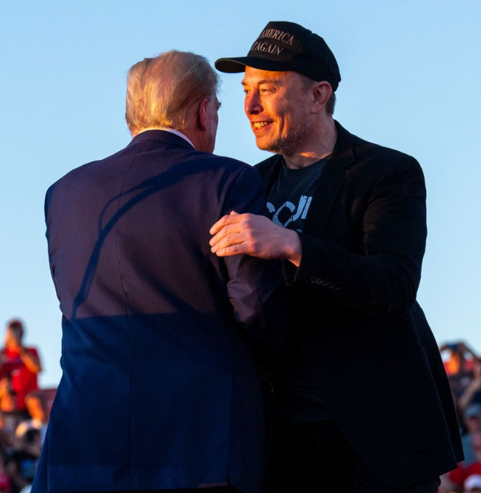 Elon Musk and Donald Trump hug